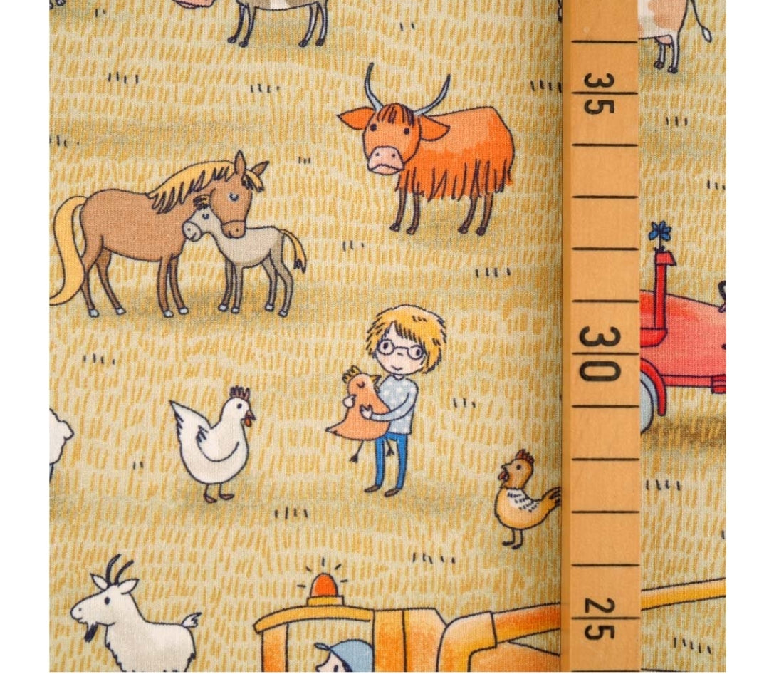 On the farm (yellow) organic jersey fabric