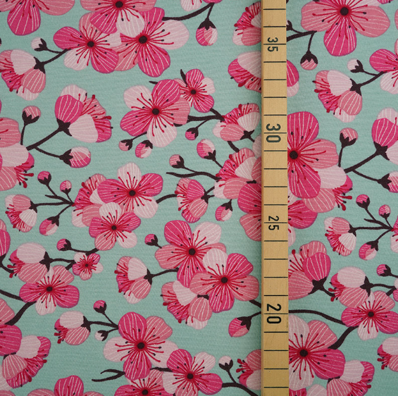 pink cherry blossoms on green background