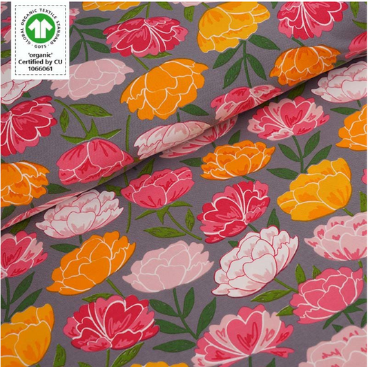 Pink and yellow peony flowers on grey background
