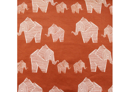 White striped geometric elephants on caramel brown background 