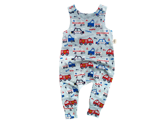 Baby jumpsuit with emergency vehicles print including fire engine, tow truck, ambulance and police car